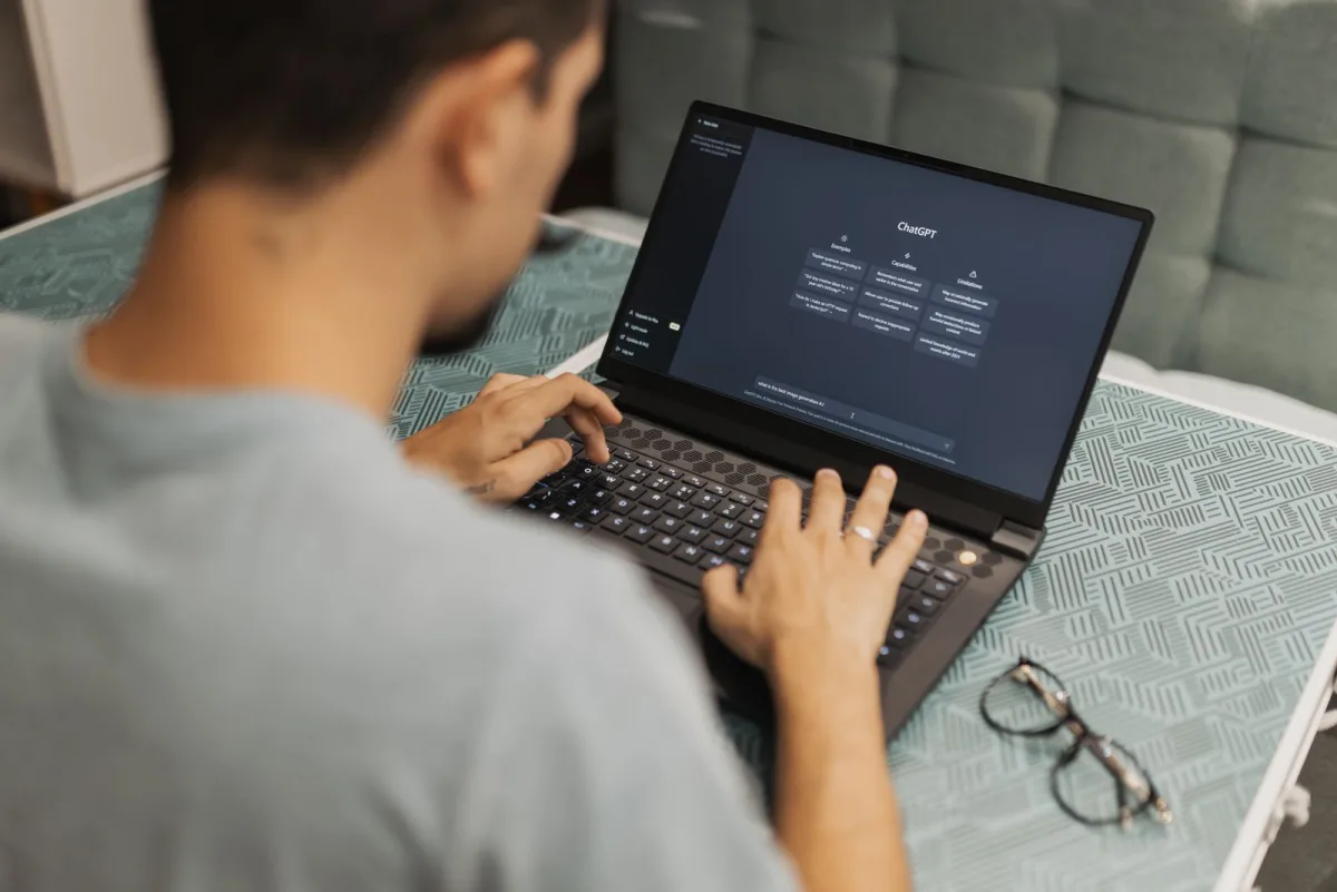 Founder working with an AI chat assistant on a laptop