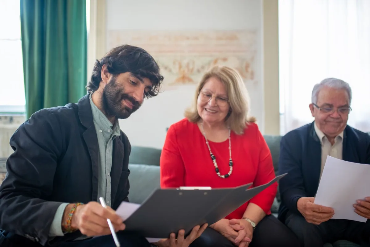 Consultant in a meeting with two clients discussing an engagement
