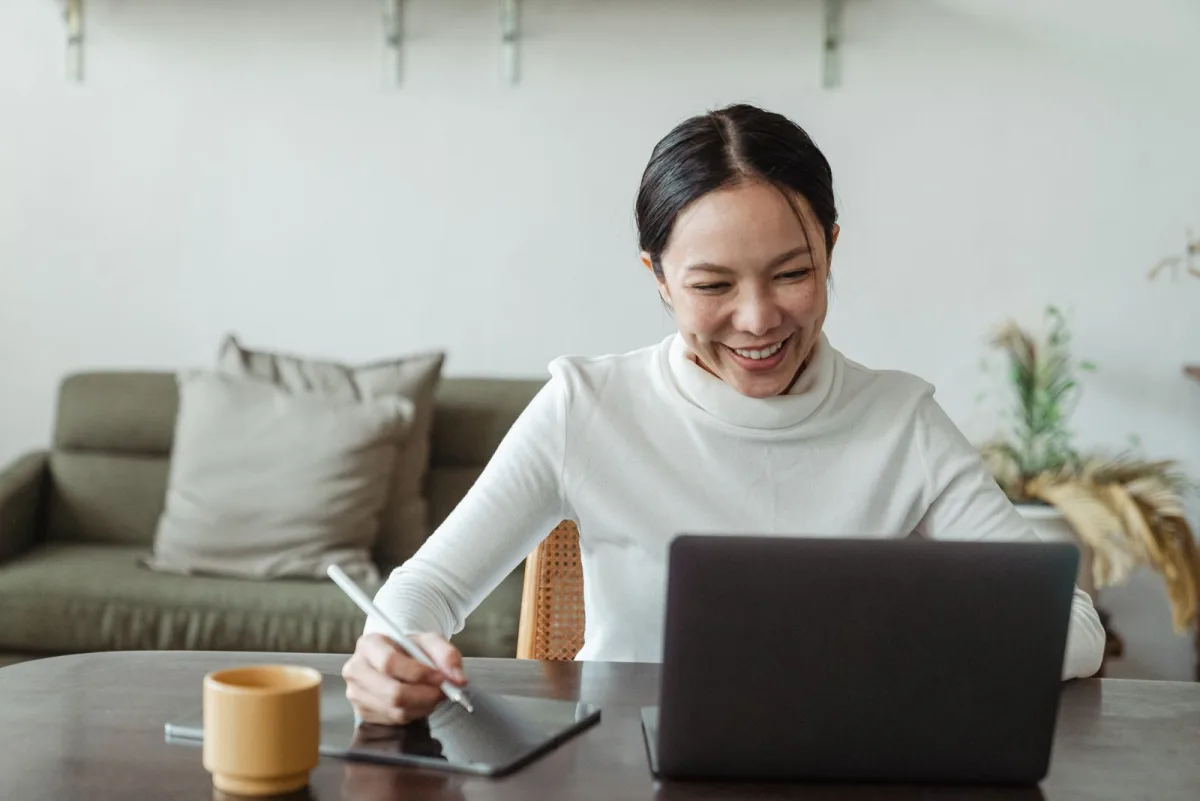 Freelancer on a video call with a client from her home office