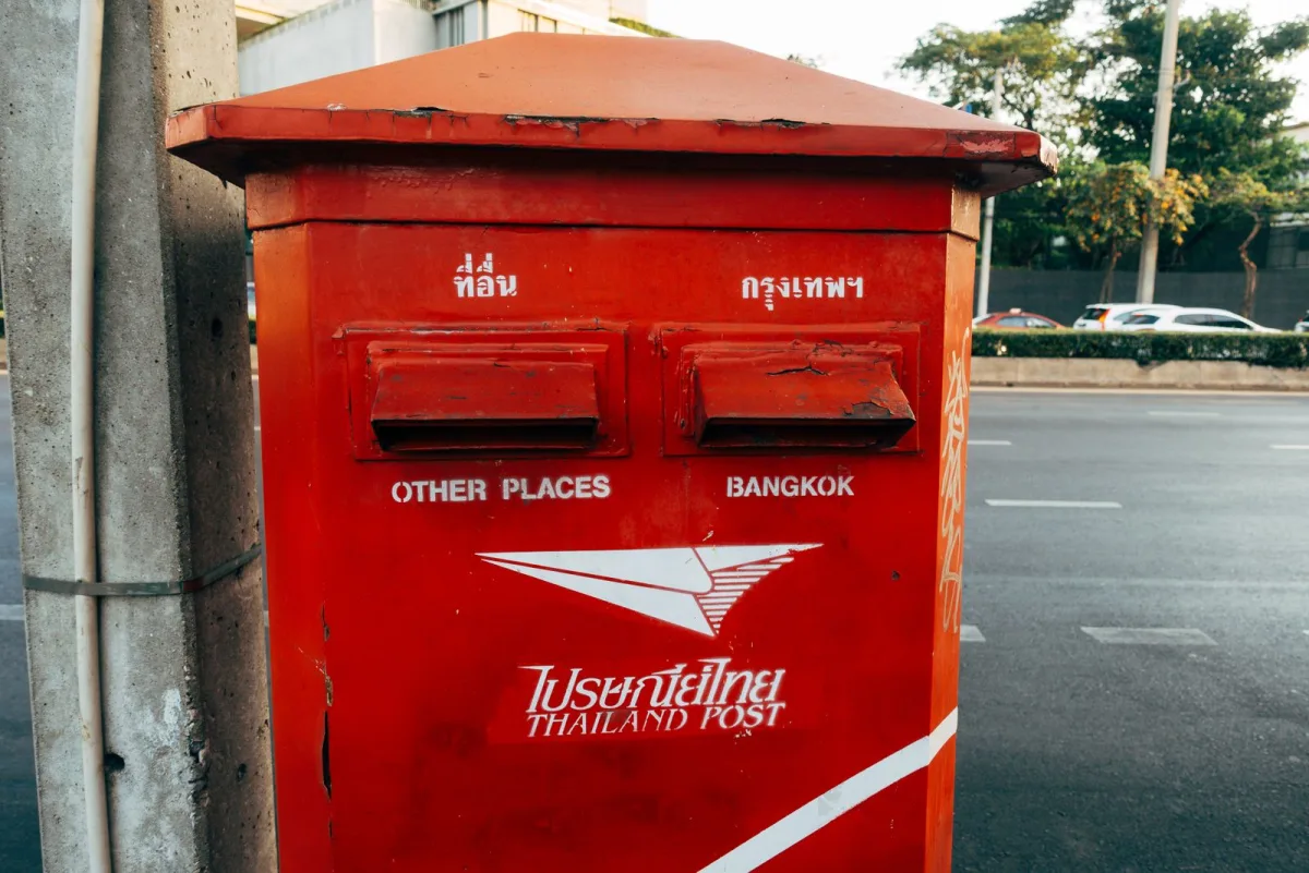 Classic red public postbox on a street