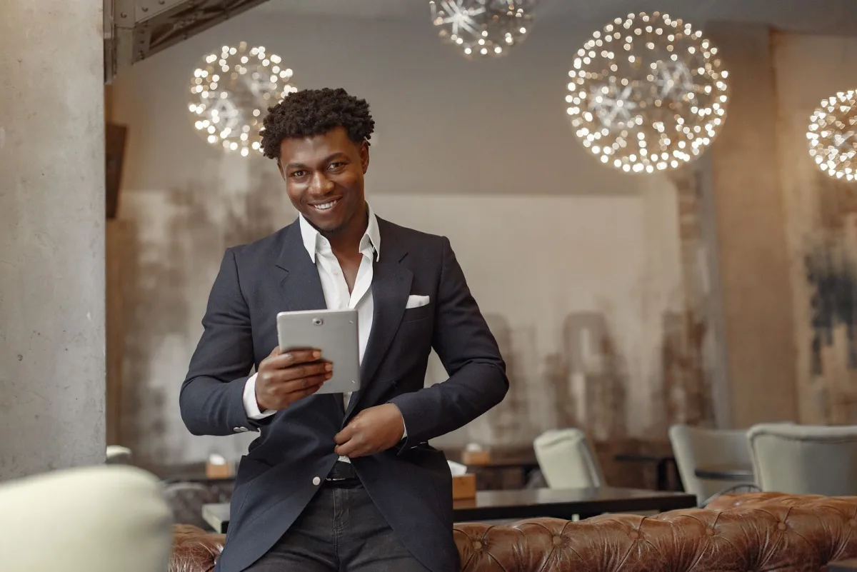 Small business owner checking a tablet in his restaurant