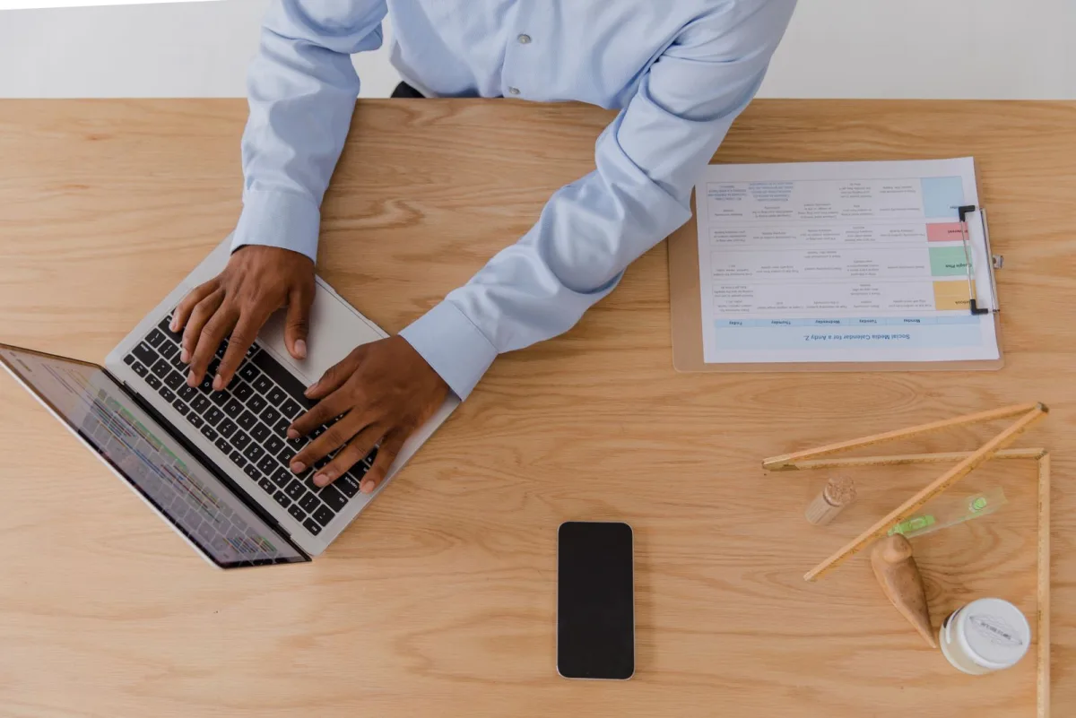 Small business owner working on a laptop at his desk