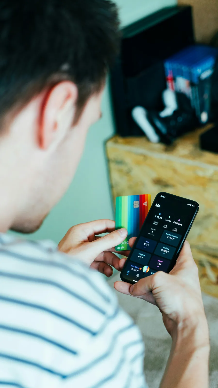 bunq app and rainbow debit card in hand
