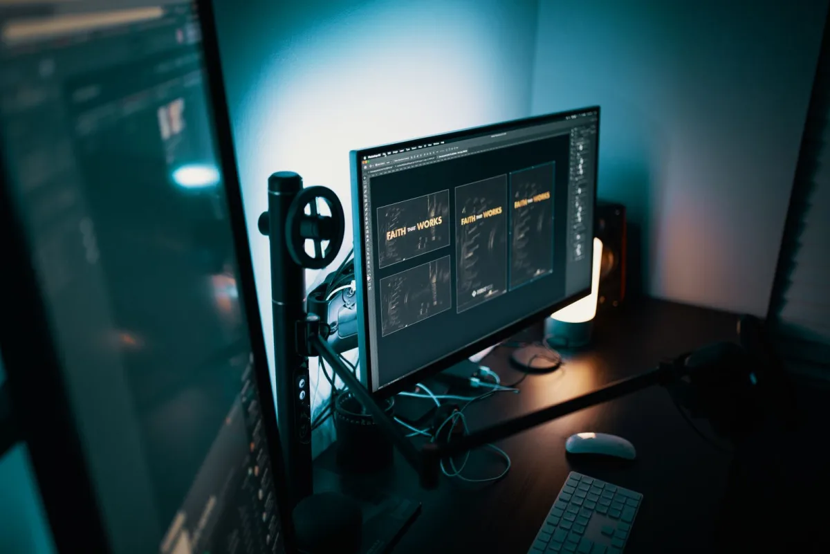 Interface design layouts displayed on a large monitor