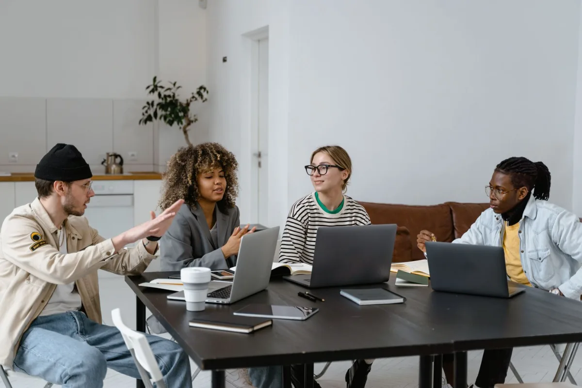 Freelancers working on laptops together in a coworking space