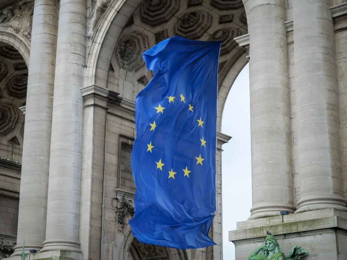 Flag of the European Union in front of a modern building in Brussels