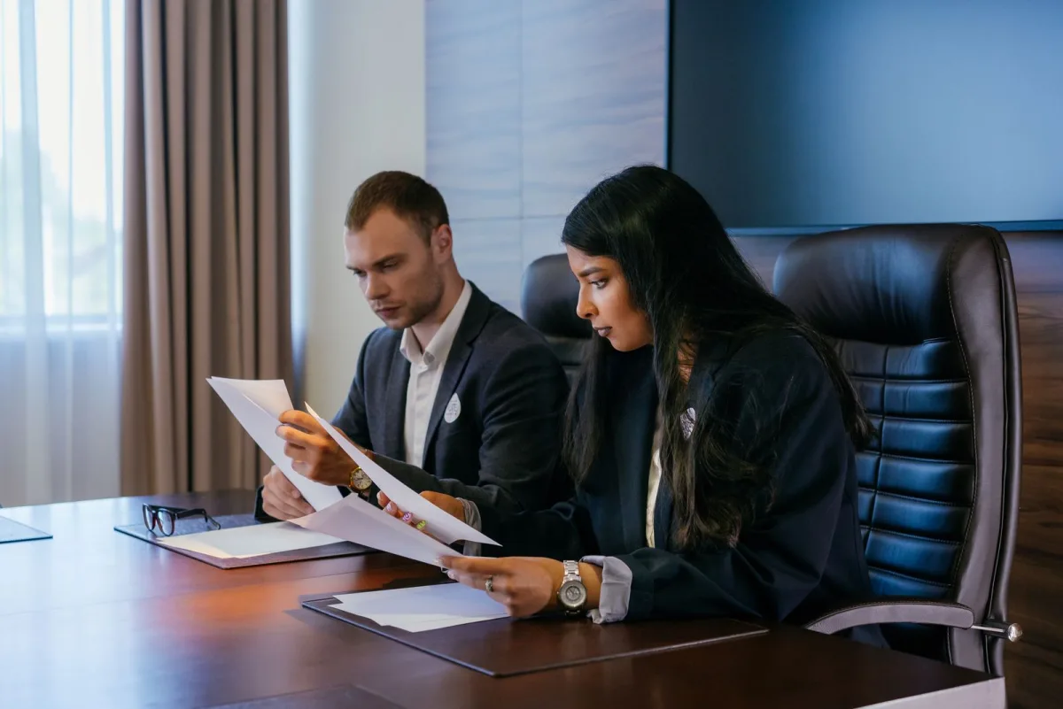 Freelancer reviewing formation paperwork with an advisor